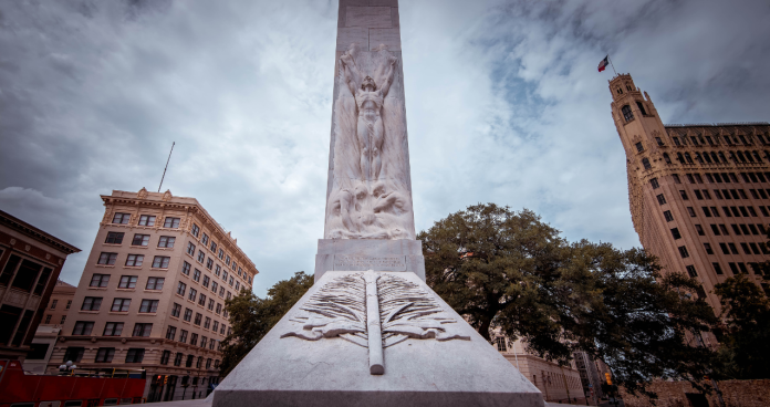 The Cenotaph memorial in London with Remembrance Day wreaths and people paying respects.