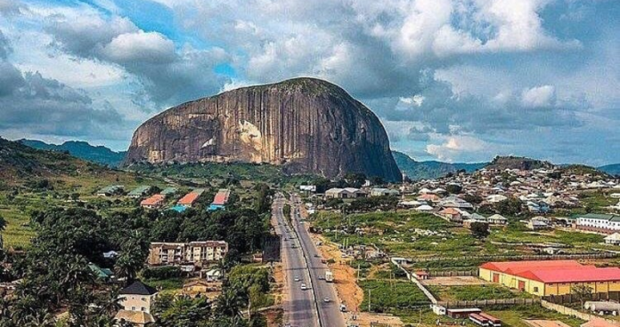 Zuma Rock, a stunning monolith in Nigeria, standing tall at sunset.